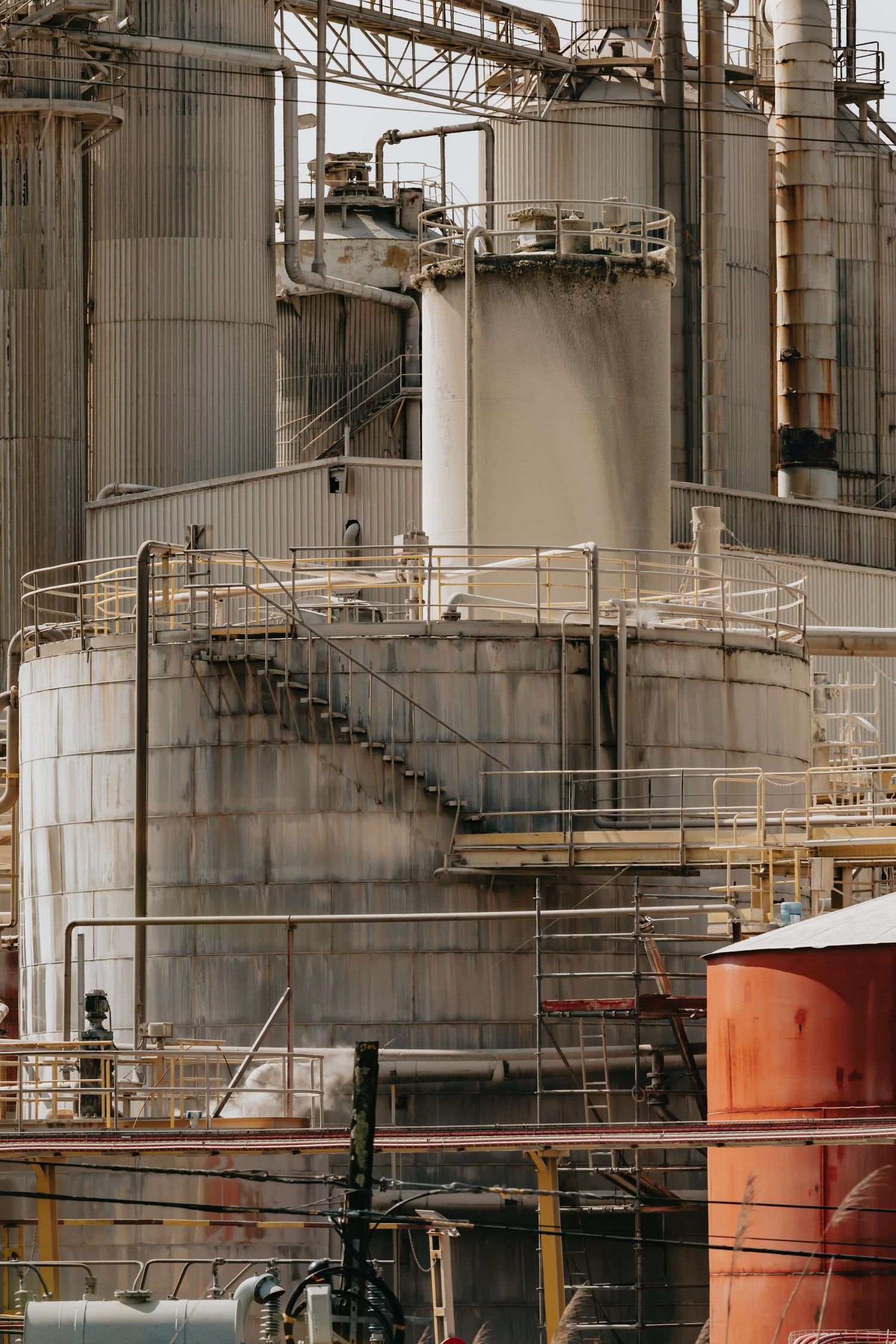 Side of industrial structure with metal ladders